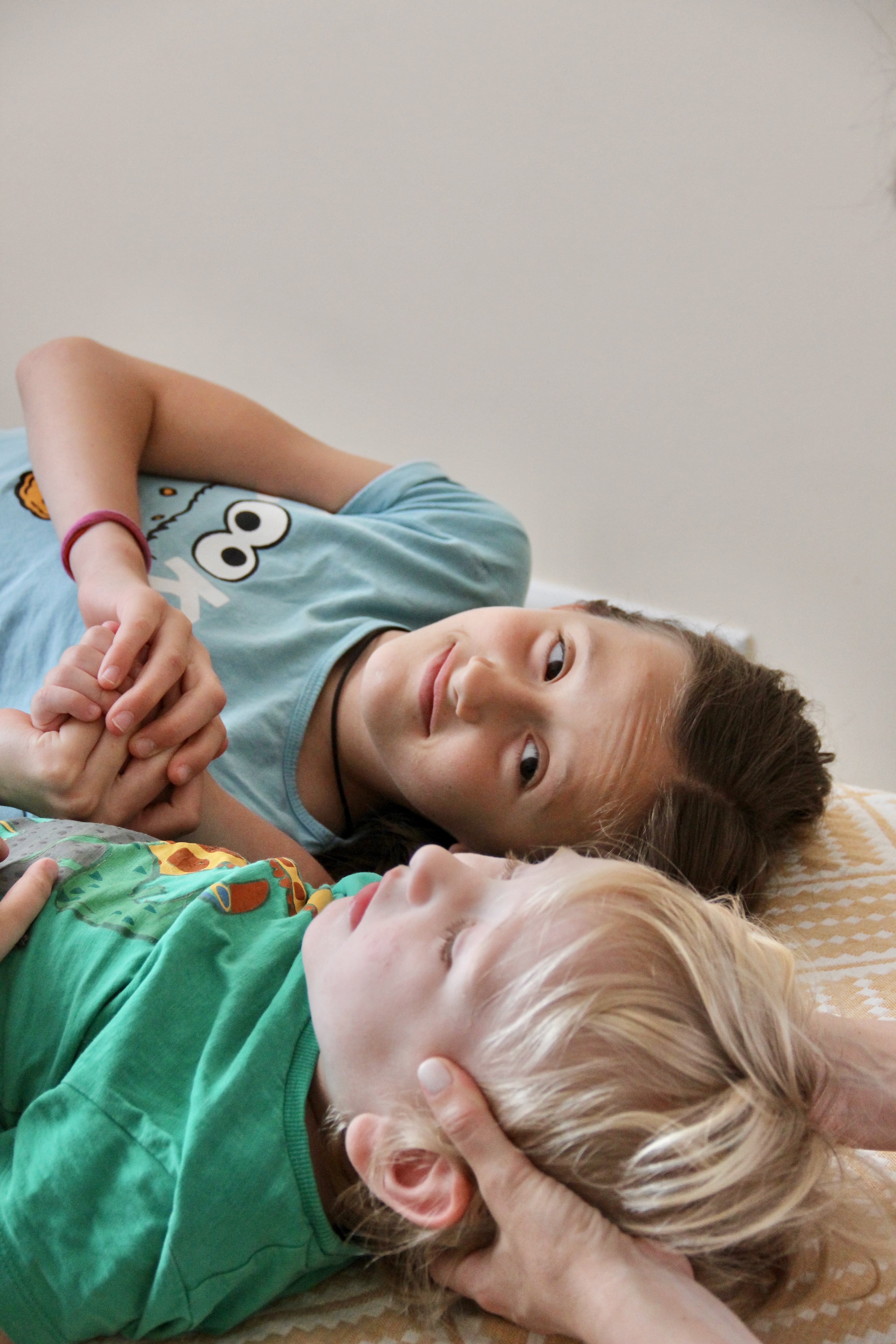 Two children receiving family osteopathic care