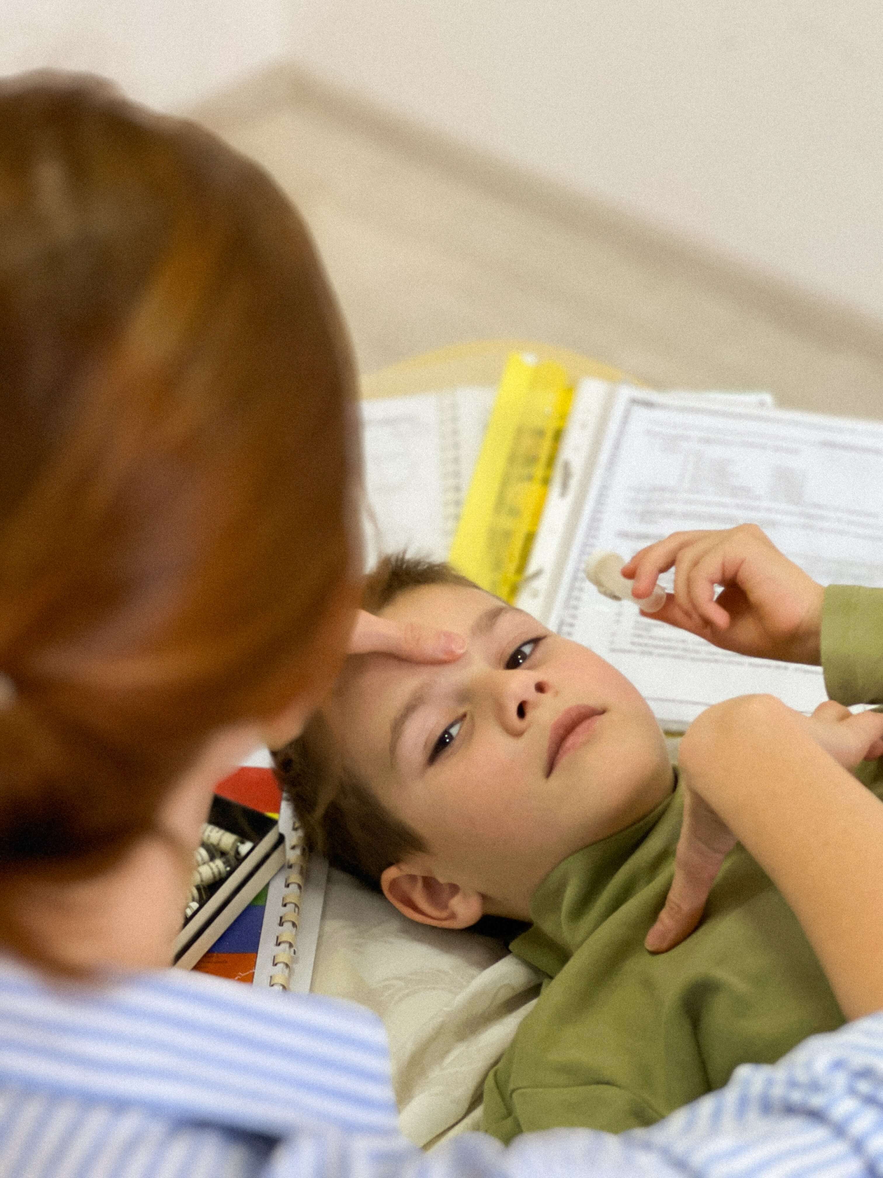 Child receiving gentle kinesiological treatment