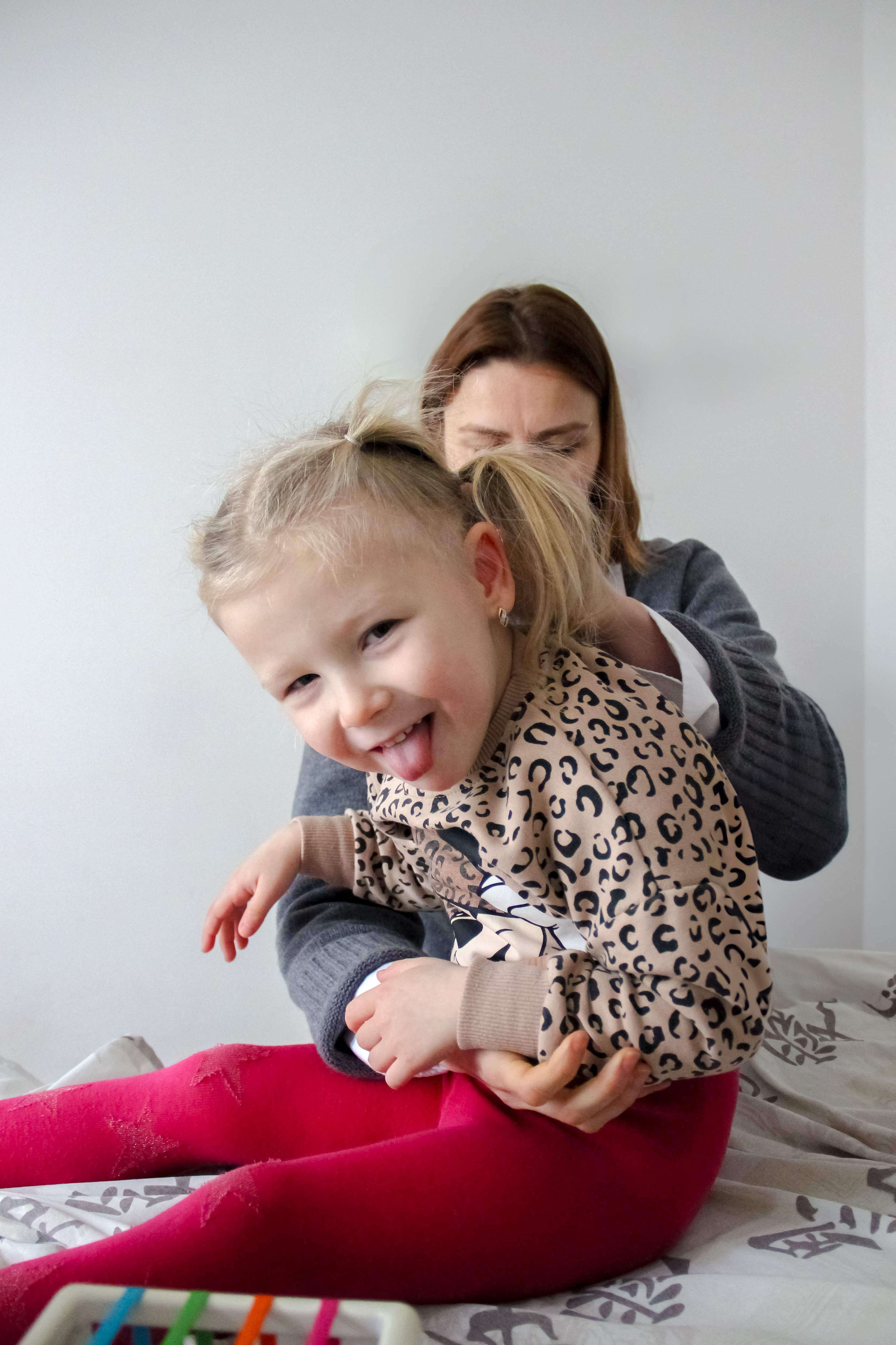 Happy child during kinesiological treatment